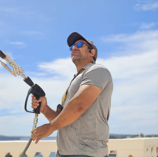 On the roof at Alcooringa, Bellevue Hill — hands-on pressure cleaning as part of the exterior restoration ahead of a sale that saw the property resell for $80 million. Klean Kingdom owner pressure washing at Alcooringa, Bellevue Hill, during exterior restoration ahead of its $80 million sale