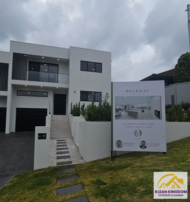 Pre-sale exterior clean at a modern home in Ryde — front facade, pathway, fencing and balcony cleared of cobwebs and dirt by Klean Kingdom ahead of listing. Klean Kingdom exterior cleaning of a modern two-storey home in Ryde ahead of sale — front facade, pathway, fencing and balcony cobweb and dirt removal